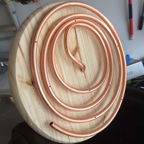 3/8in Copper Coil with small holes drilled in it.